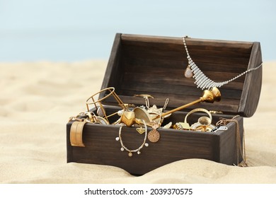 Open Wooden Treasure Chest On Sandy Beach