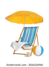 Open yellow beach umbrella, deck chair, inflatable ball and accessories on white background