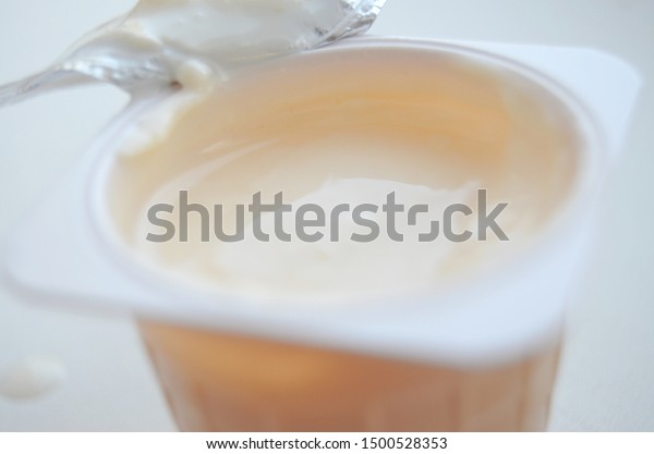 Download Open Yogurt Cup On White Background Stock Photo Edit Now 1500528353 PSD Mockup Templates