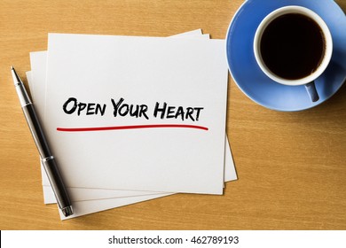 Open your heart    handwriting papers and cup coffee   pen  concept