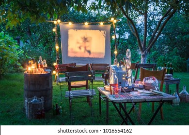 Open-air Cinema With Drinks And Popcorn In The Garden
