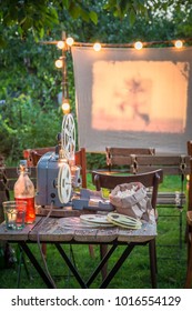 Open-air Cinema With Retro Projector In The Garden