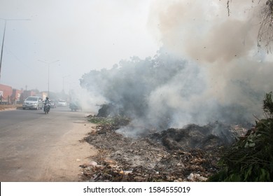 An Open-air Roadside Garbage Heap Being Burnt In India Causing Dense Smoke And Toxic Pollution. While This Is Not Legal, It Is Still A Common Practise.