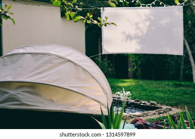 Open-air Summer Outdoor Cinema In A Private Yard. Fountain.