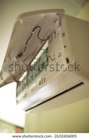 Opened Air Conditioner Unit with Exposed Interior Components - Home Appliance Maintenance Concept