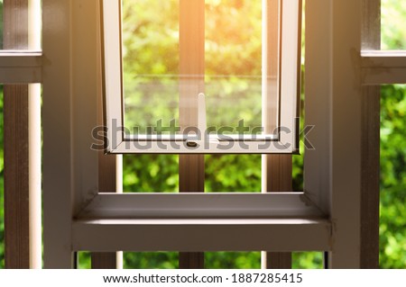 Opened aluminium window with latch handle