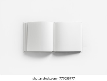 Opened blank square book on white paper background. Flat lay. - Shutterstock ID 777058777