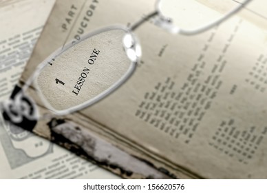 The opened book and glasses 