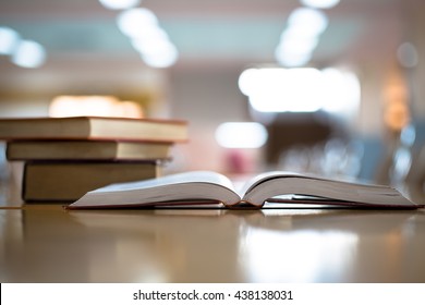 Opened book on the desk.Vintage style. - Shutterstock ID 438138031