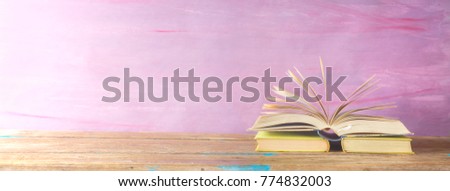 opened book on grungy background, panorama, good copy space