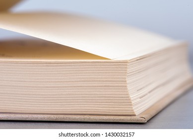 Opened book on table macro