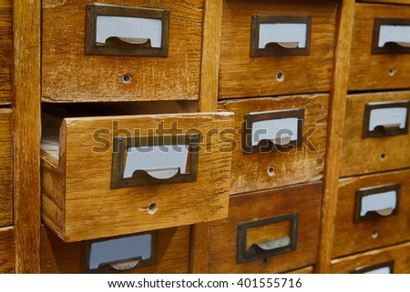Opened box archive storage, filing cabinet interior. Vintage wooden boxes with blank index cards. library service and information management concept. soft focus