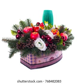 opened box with composition of fir branches candles and new year balls