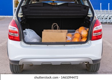 Opened Car Trunk With Bags With Food Purchased In Grocery Store