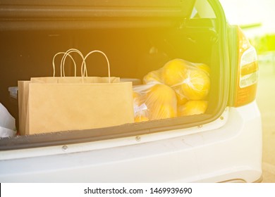 Opened Car Trunk With Bags With Food Purchased In Grocery Store