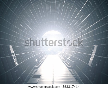 Opened cargo module of a spacecraft with light at the end. Light at the end of tunnel. 