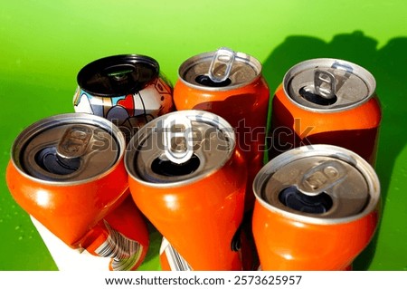 Opened Coke Cans background, texture. Open drink soda cans close up, top view. Open coke can, background, texture. Pop top aluminum can with waterdrops after used. Open drink can, close-up.