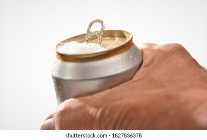 Opened Cold Beer Can In Man Hand On White Background