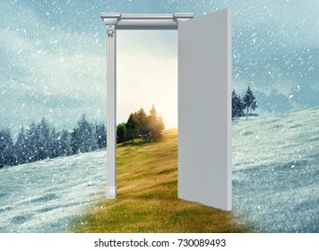 Opened door on a field during winter which leads to a warmer season. Changing season through the door concept.