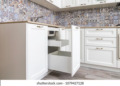 Opened Drawer With High Front Under A Sink, Large Drawer For A Garbage Bin, Inner Drawer For Garbage Bags Storage And Small Detergents. Clever Solution For Kitchen Storage And Organization. 