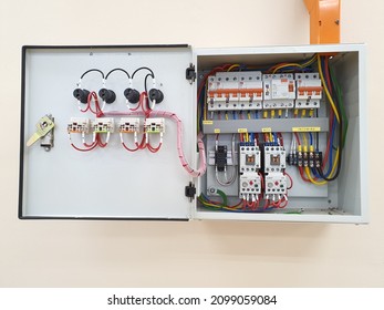 An opened of electrical panel board. Steel square box. Accessories such as miniature circuit breaker and earth leakage circuit breaker elcb. Colorful wire cable. Electricity. Malaysia. December 2021