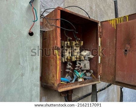 Opened, exposed  electrical box of an old abandoned building close up shot.