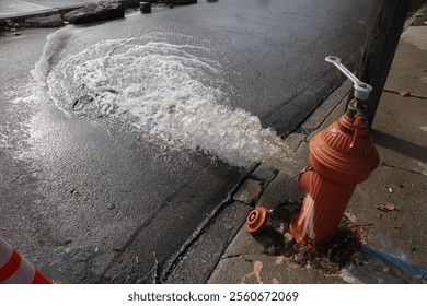 opened Fire hydrant with key ,with rushing water 