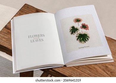 Opened floral magazine pages on a table - Powered by Shutterstock