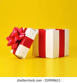 Opened Gift Box Close Up Isolated On Yellow Background 