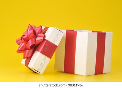 opened gift box close up isolated on yellow background - Powered by Shutterstock - Get 15% off with code: PIKWIZARD15