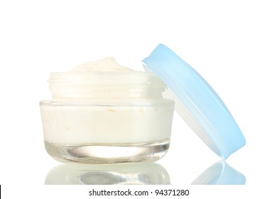 Opened glass jar of cream isolated on white