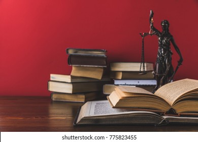 Opened Juridical Books With Lady Justice Statue On Wooden Table, Law Concept