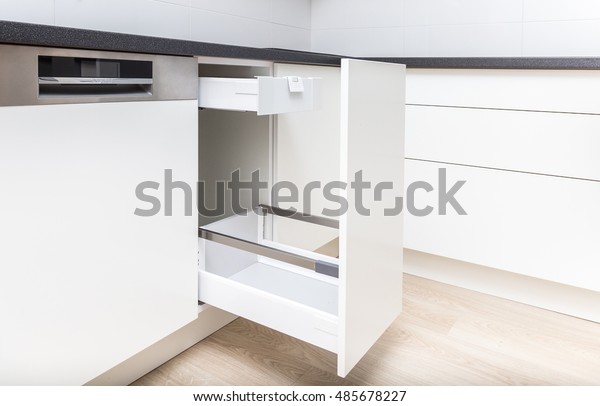 Opened\
kitchen drawer with high front for garbage bin and inner drawer\
inside for sundries and other small objects\

