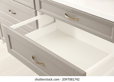 Opened kitchen drawer in room, closeup