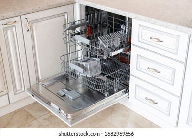 Opened New Empty Dishwasher Machine In The Kitchen