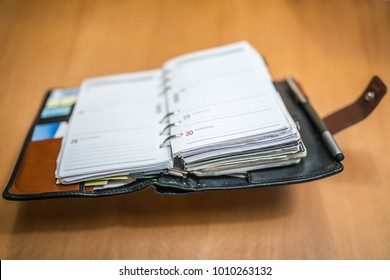 opened notebook, filofax on a table, desk