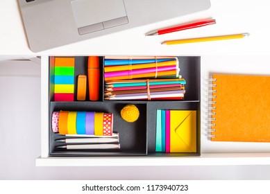 Opened Office Desk Drawer With Stationary 