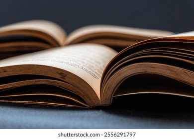Opened old book on a table, close-up