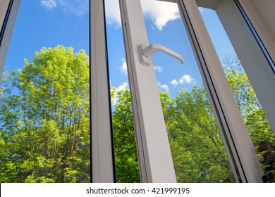 Opened Plastic Vinyl Window On Green Trees Background