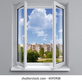 Opened plastic window new in room with view to city buildings