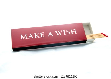 opened red, long match box, make a wish written on it. match sticks.