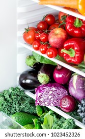 Opened Refrigerator Full Of Vegetarian Healthy Food, Vibrant Colour Vegetables And Fruits Inside On Fridge, Focus On Red Cabbage