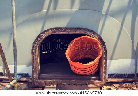 opened rusty manhole on the gray fuel tank