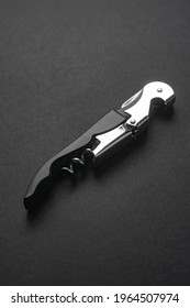 Opened Sommelier Knife With Corkscrew And Bottle Opener, Professional Waiter Knife, On Black Background