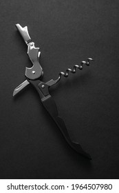 Opened Sommelier Knife With Corkscrew And Bottle Opener, Professional Waiter Knife, On Black Background