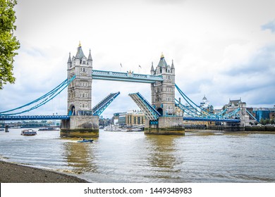 Opened Tower Bridge In The Cloudy Day, London