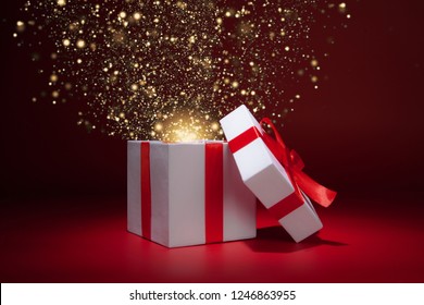 Opened White Gift Box On Red Background