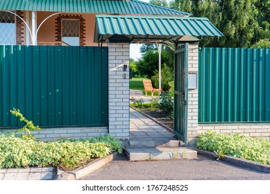 Opened Wicket Gate Door To A Private House