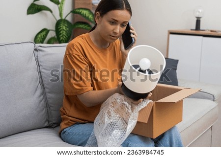 Opened the wrong parcel at home, bummer. Lady's confused face says it all. Now, chatting with customer service for a return.