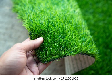 Opening Artificial Grass Mat Isolated Background.